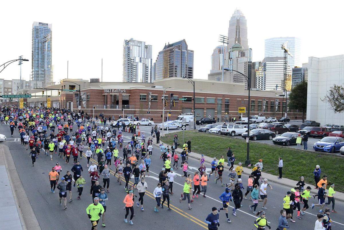 Thousands of runners surged from the start of the Thunder Road Marathon at 7:30am Saturday on Graham Street.  If you are a runner, a walker, or wheel chair athlete in the Charlotte region the Novant Health Thunder Road Marathon had it all for you. An estimated 6,000 folks took part on Saturday Nov. 14, 2015. About 1,200 of those running the 26.2 miles of the marathon. The rest got their run on through  several events including as a marathon relay team, a 1/2 marathon, a 5K run/walk, and a one mile fun run for kids.