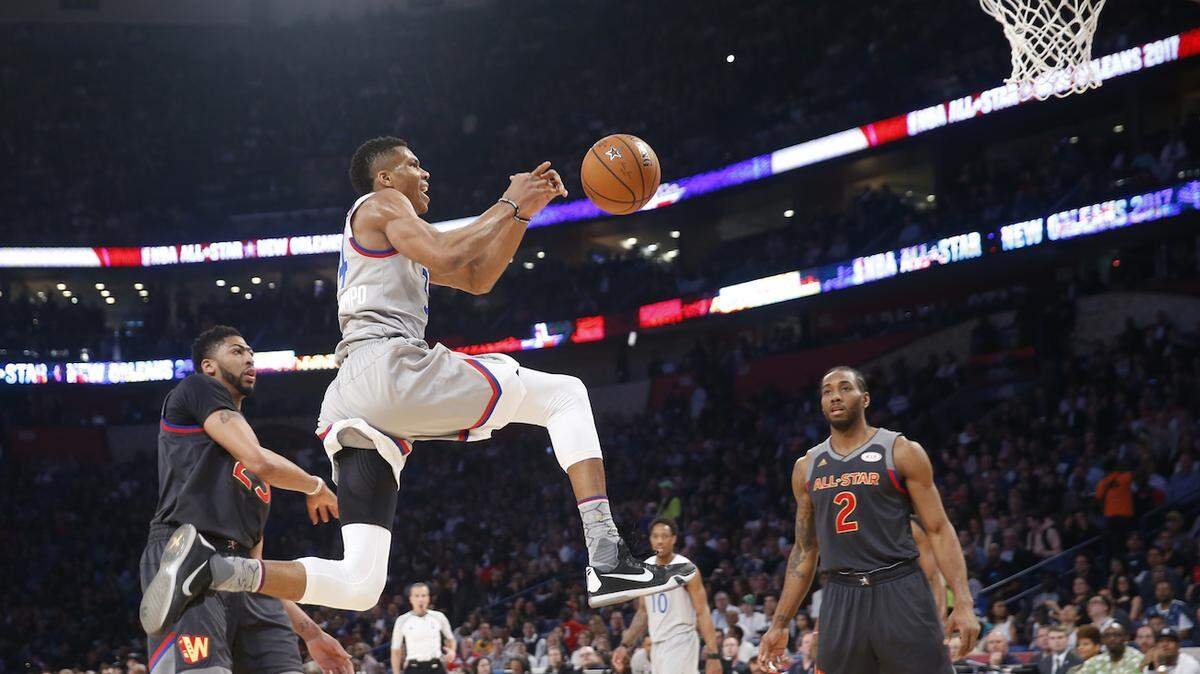 Eastern Conferences forward Giannis Antetokounmpo of the Milwaukee Bucks (34) goes for a layup against Western Conference forward Anthony Davis of the New Orleans Pelicans (23) and Western Conference forward Kawhi Leonard of the San Antonio Spurs (2) during the first half of the NBA All-Star basketball game in New Orleans, Sunday, Feb. 19, 2017. (AP Photo/Gerald Herbert)