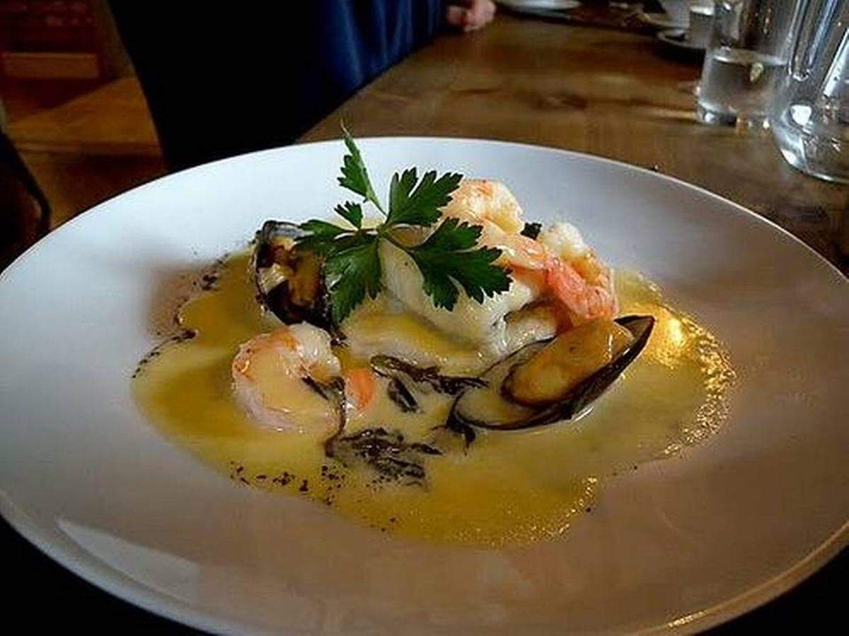 Lumiere in Myers Park was known for elegant presentations of French-inspired food, like slow-cooked turbot with shrimp and mussels. Observer file photo