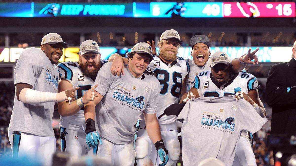Panthers celebrate following the team's 49-15 victory over the Arizona Cardinals in the NFC Championship game at Bank of America Stadium Sunday, January 17, 2016.