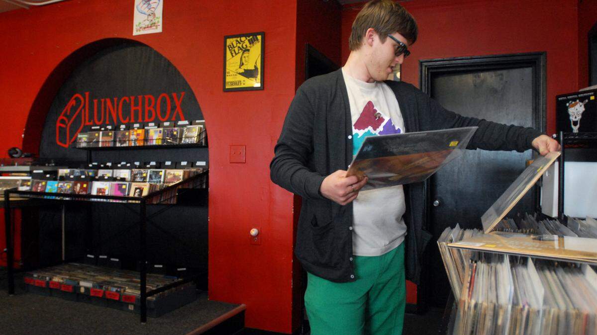 (04.16.2009)--(name cq'd)--Zach Wright, 22, looks at vinyl records at Lunchbox Records in Plaza-Midwood on Thursday, April 16, 2009. This upcoming Saturday is Record Store Day, an event taking place nationwide, intended to draw attention to independent music retailers. - YALONDA M. JAMES - yjames@charlotteobserver.com