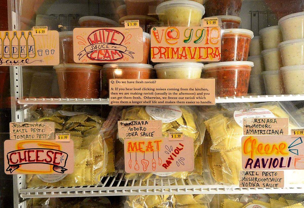 Shelves of prepared ravioli and sauces at Pasta & Provisions on Providence Road.