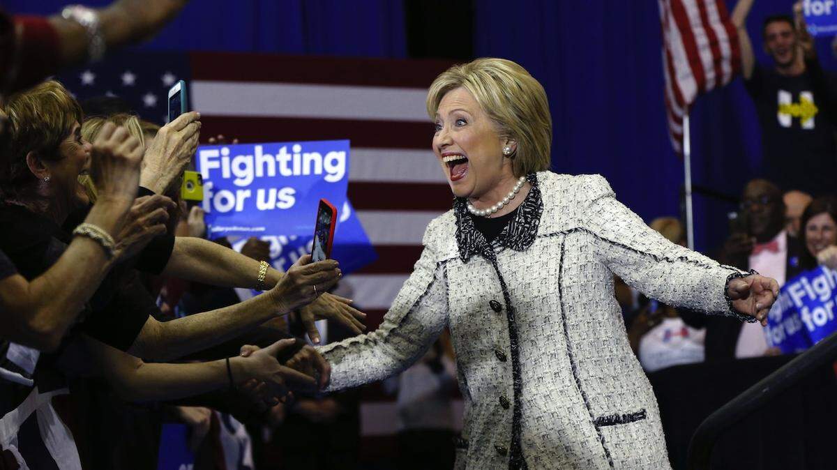 Democratic presidential candidate Hillary Clinton greets supporters as she arrives to speak to supporters at her election night watch party for the South Carolina Democratic primary in Columbia, S.C., Saturday, Feb. 27, 2016. (AP Photo/Gerald Herbert)