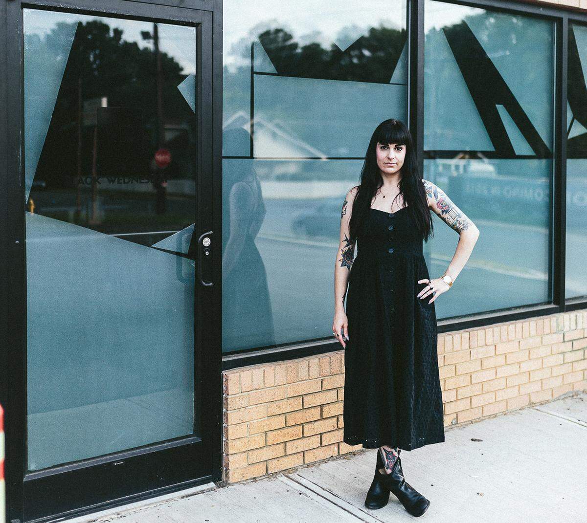 Photo by Remy Thurston<br/>Corri Smith outside of her Black Wednesday office in NoDa.