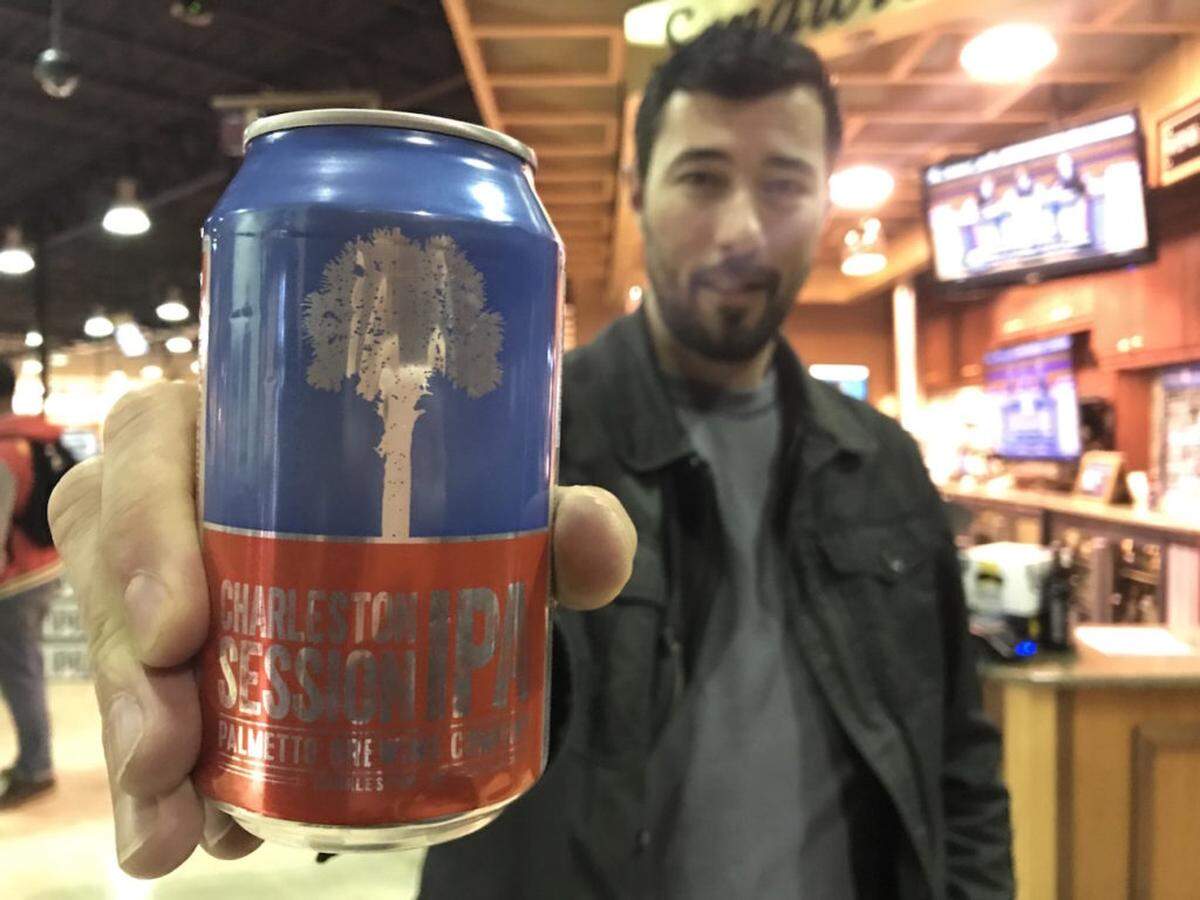 Michael Kissiah with Palmetto Brewing Company shows off a Charleston Session IPA at 201 Central in Huntersville.