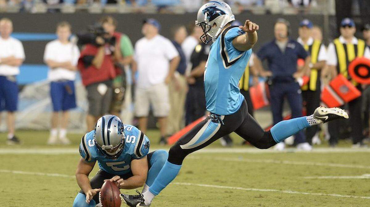 Carolina Panthers kicker Graham Gano (9) lines up a field goal, as punter Michael Palardy (5) positions the ball,  against the New England Patriots during the first half at Bank of America Stadium on Friday, August 24, 2018. Photo by David T. Foster III.
