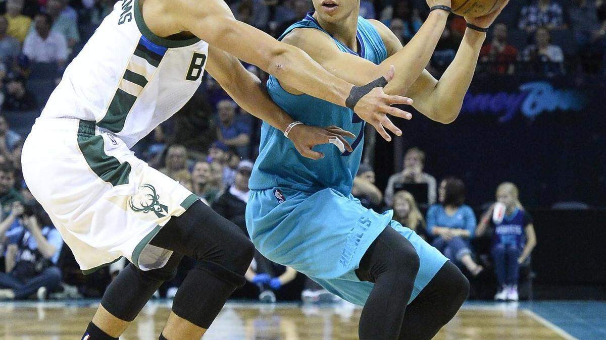 From left Milwaukee Bucks Michael Carter- Williams guards Charlotte Hornets Jeremy Lin  during Sunday's game played at Time Warner Cable Arena Nov. 29,2015. The Charlotte Hornets defeated the Milwaukee Bucks 87-82.