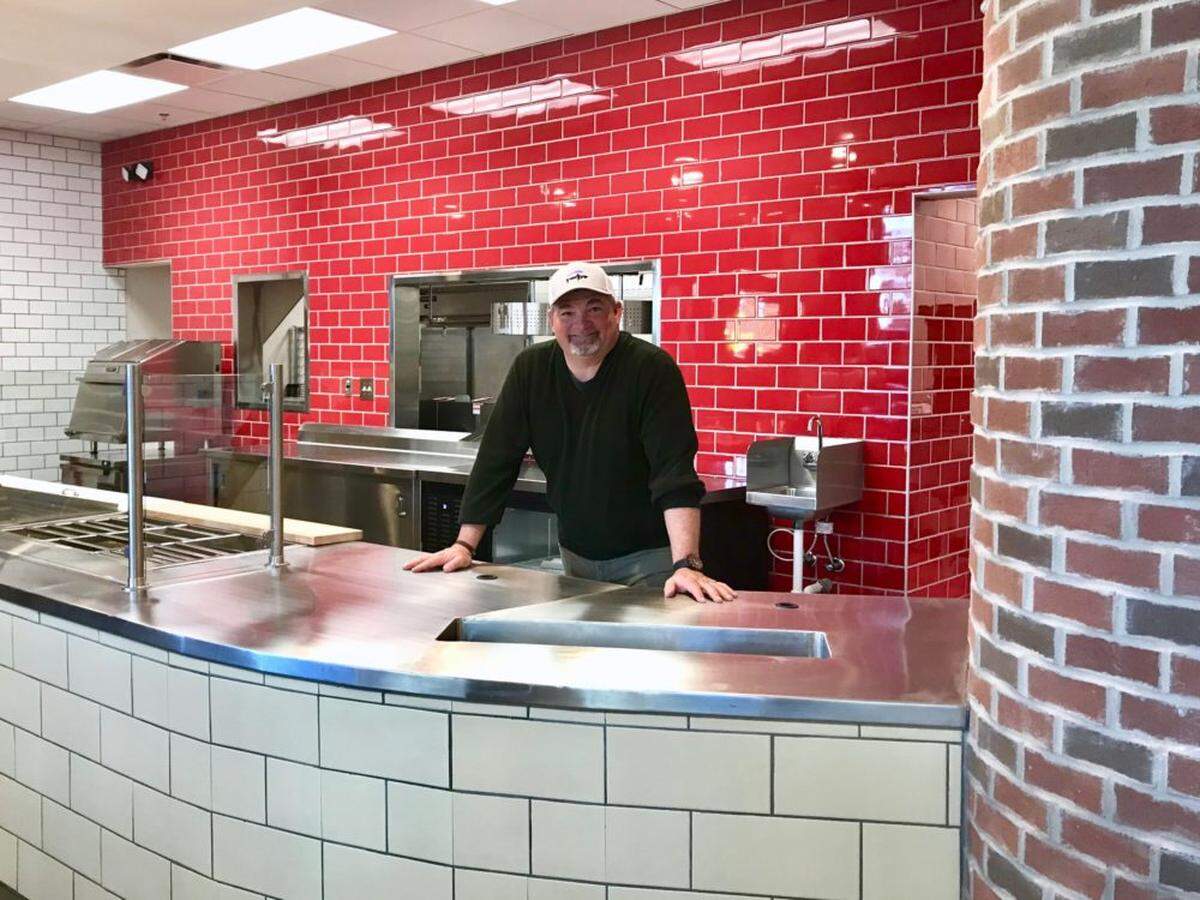 Jon Luther Jr. in the new uptown location.