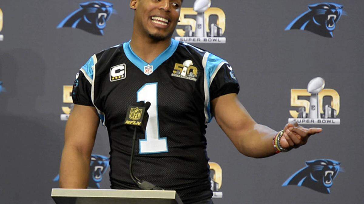 Carolina Panthers quarterback Cam Newton reacts as he answers a question about a game he played in at Blinn College during a media interview session at the San Jose Convention Center on Wednesday, February 3, 2016 in preparation for Super Bowl 50.