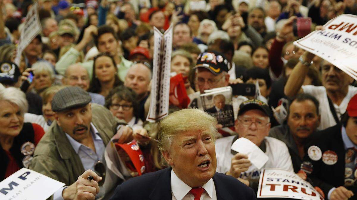 Republican presidential candidate Donald Trump speaks speaks with members of the media as he meets with attendees during a campaign stop, Friday, Feb. 19, 2016, in Myrtle Beach, S.C. (AP Photo/Matt Rourke)