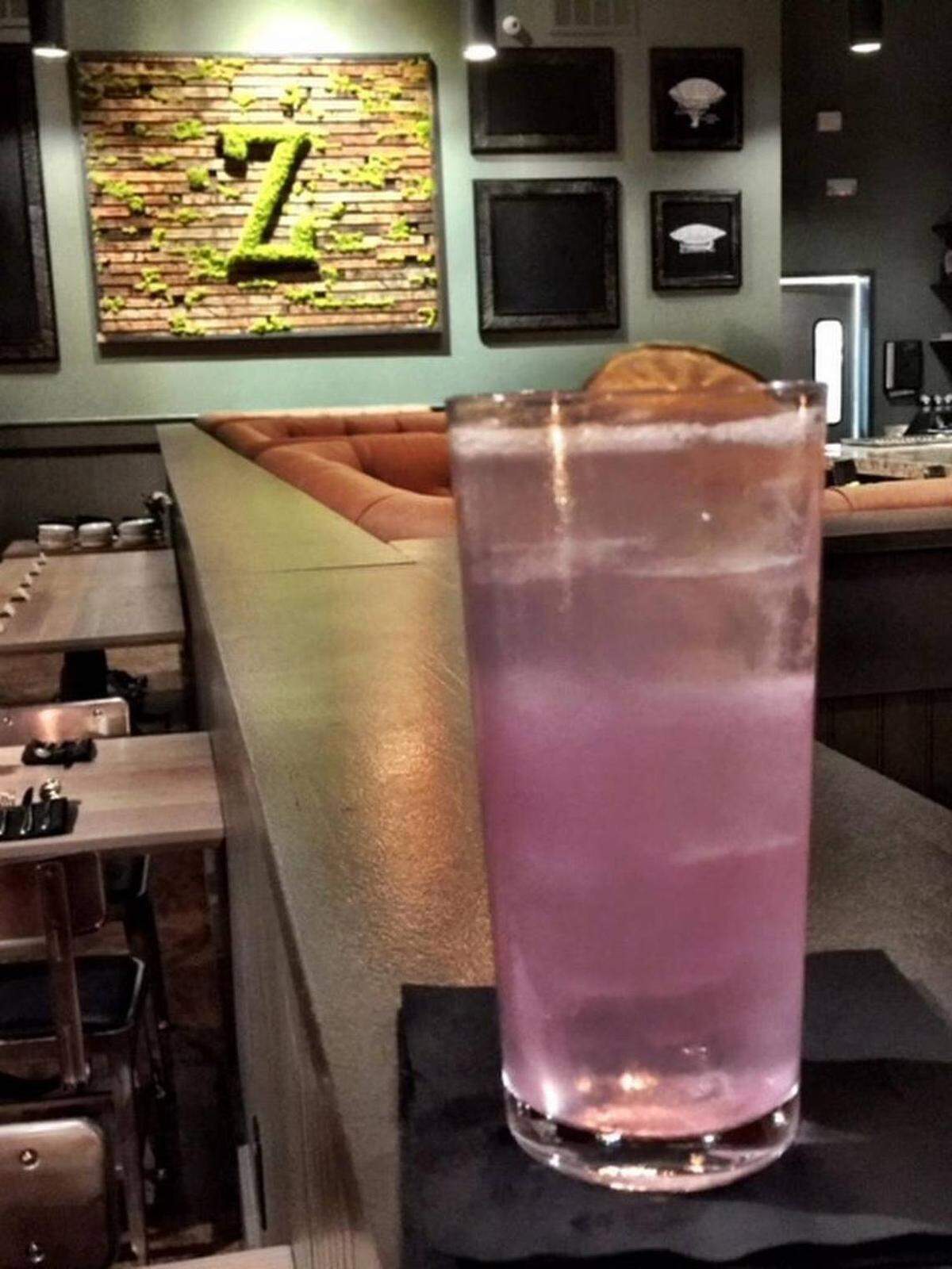 Foggle Fizz, a take on a gin fizz, turns pink with help from a butterfly tea flower infusion that reacts with acidity from a yuzu-lemongrass cordial.