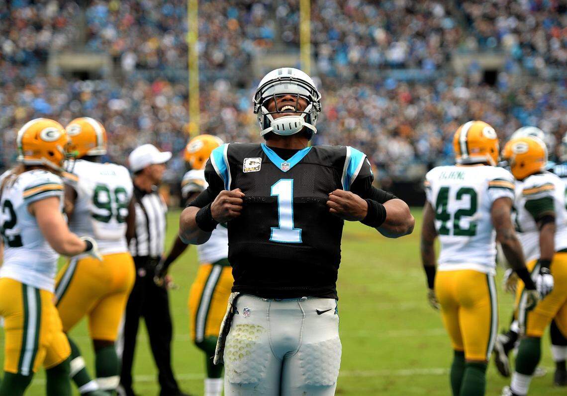 Carolina Panthers quarterback Cam Newton celebrates his touchdown vs the Green Bay Packers during second quarter action at Bank of America Stadium in Charlotte, NC on Sunday, November 8, 2015.