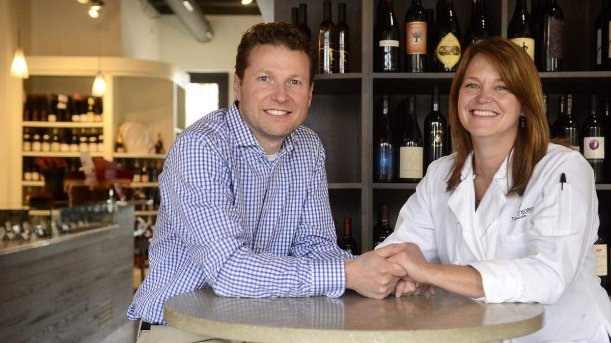 Mark Meissner and Casey Hickey are married and together they run Petit Philippe, a wine and chocolate shop and tasting room on Selwyn Ave. Mark oversees the wine operation, while Casey, a certified pastry chef who studied in France, handles the chocolate. The couple posed for a portrait on Thursday February 6, 2014.