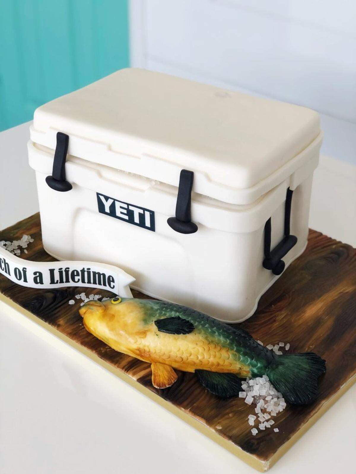 Jossie P designed this "Catch of a Lifetime" groom's cake complete with fish and Yeti cooler. Photo courtesy of Sweet Affairs