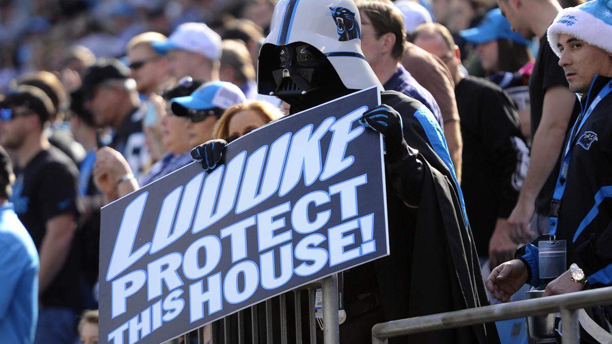 A Carolina Panthers fan holds up a sign toward the sideline prior to playing the Atlanta Falcons at Bank of America Stadium on Sunday, December 13, 2015. The Panthers won, 38-0.