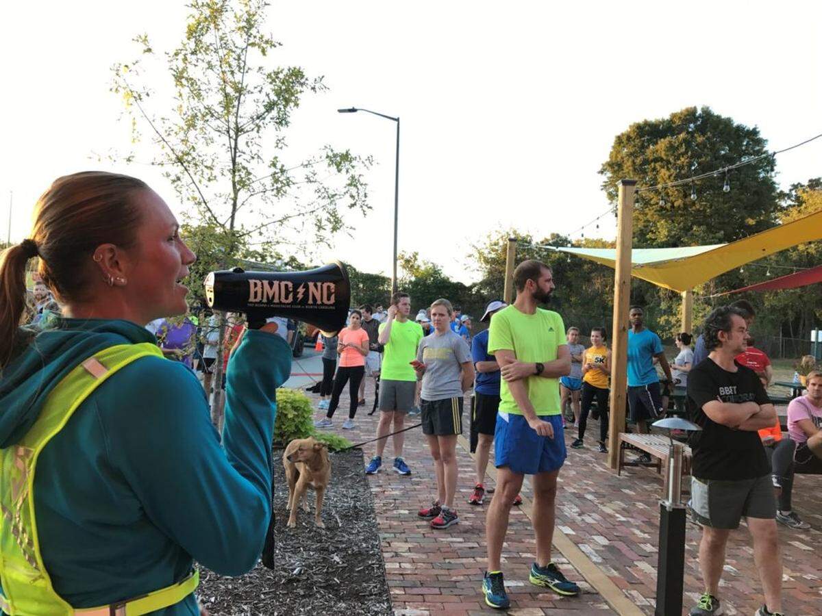 Run club coordinator Carla Garrison-Mattos announces the start of the run from NoDa Brewing’s patio at the new taproom on Tryon Street.