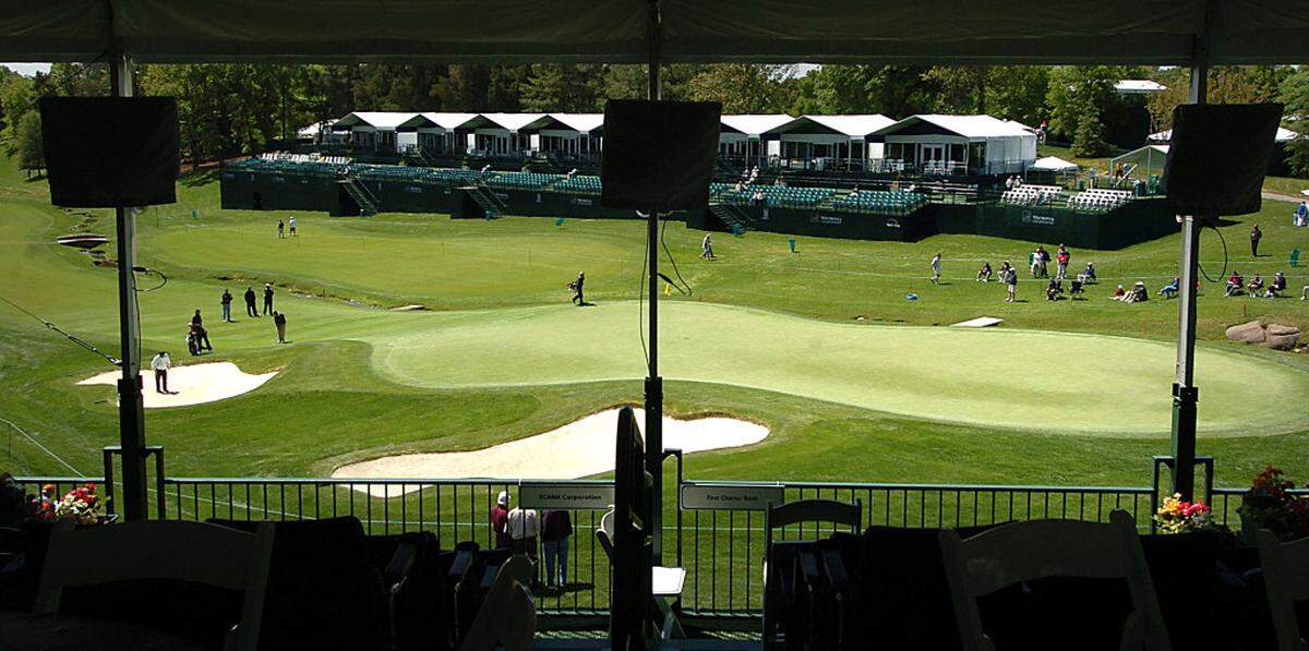 4/29/2008 Players practice Tuesday on #18 green near corporate hospitality tents for the upcoming Wachovia Championship at Quail Hollow Club in Charlotte.LAYNE BAILEY - lbailey@charlotteobserver.com