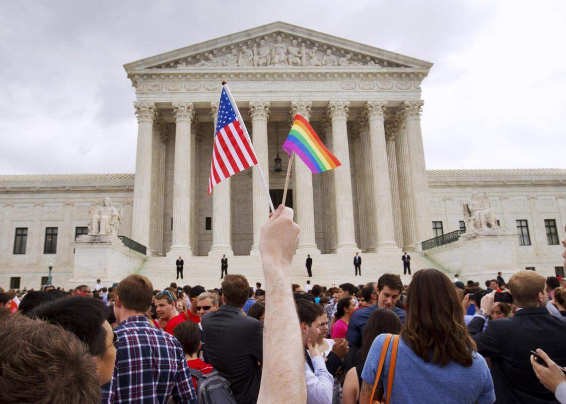 In this June 26, 2015 file photo, the crowd celebrates outside of the Supreme Court in Washington after the court declared that same-sex couples have a right to marry anywhere in the U.S.