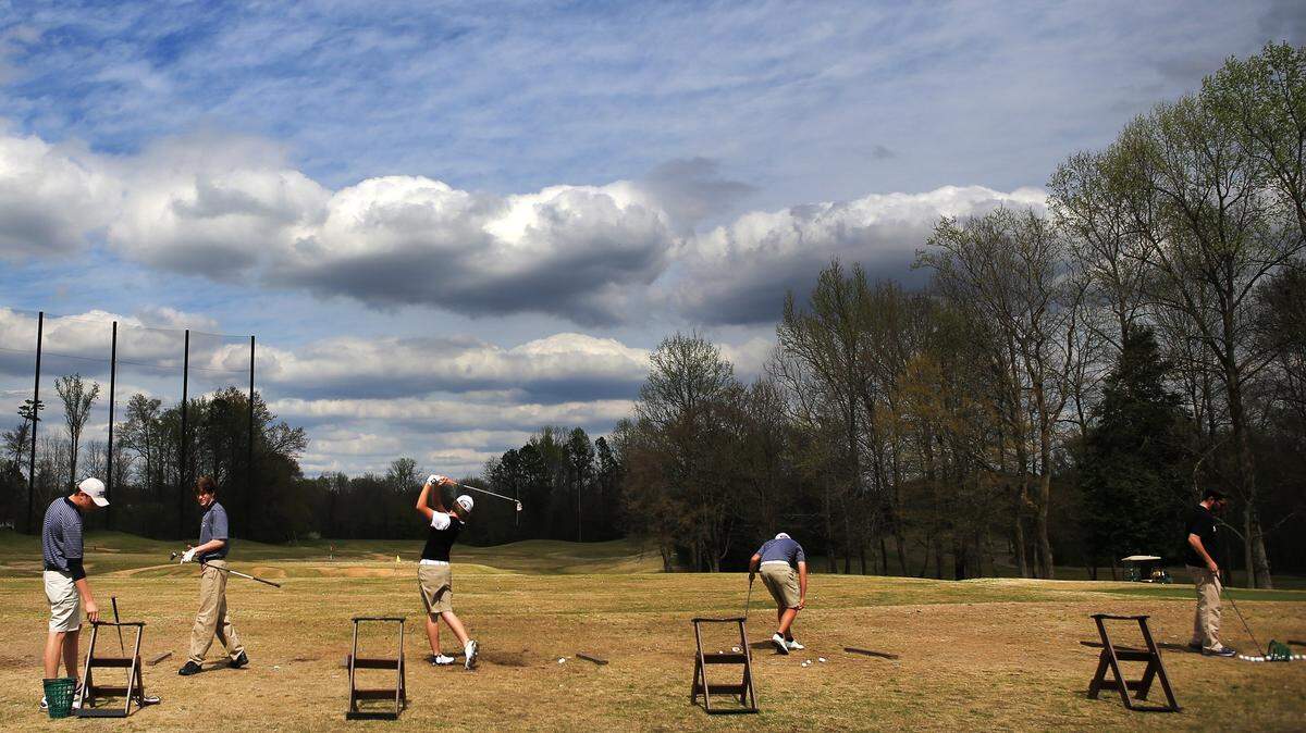 Golfers take advantage of the spring weather at Birkdale Golf Club's driving range in Huntersville, NC on April 8, 2014.