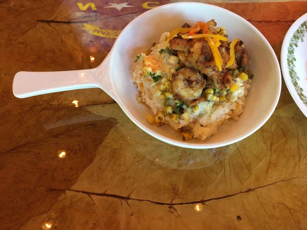 NC shrimp and grits with smoked jalapenos, grilled corn, pickled peppers, Tabasco butter and bacon cream sauce.