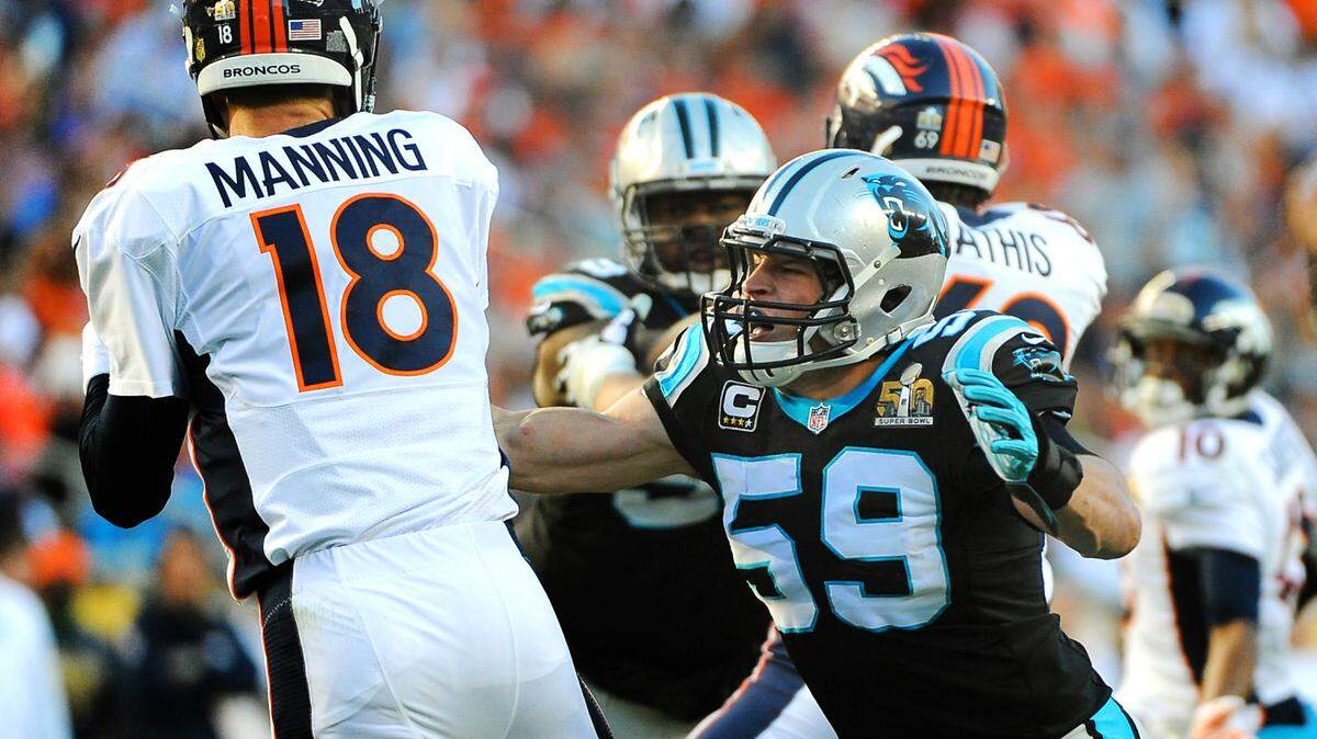 Carolina Panthers linebacker Luke Kuechly, right, prepares to tackle Denver Broncos quarterback Peyton Manning during first quarter action at Levi's Stadium in Santa Clara, CA. on Sunday, February 7, 2016. The Denver Broncos defeated the Carolina Panthers 24-10.