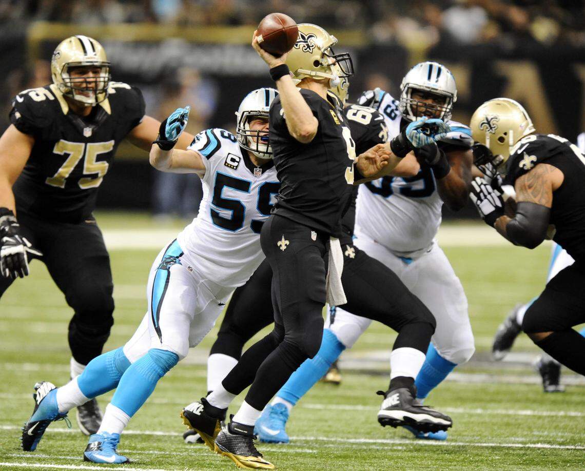 Carolina’s Luke Kuechly (59) pressures New Orleans QB Drew Brees (9) in 2015. The two men shared a mutual respect, and watching them play each other was like watching two chess grandmasters.