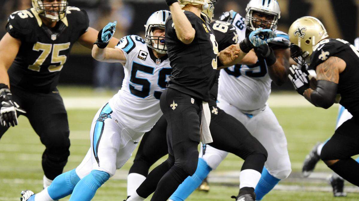 Carolina Panthers' Luke Kuechly (59) pressures New Orleans Saints' Drew Brees (9) in the first half at the Mercedes-Benz Superdome on Sunday, December 6, 2015. The Panthers won  41-38, and improve to 12-0.