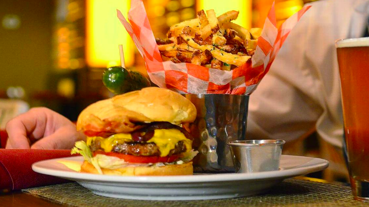 Tom Condron’s burgers at The Liberty include house-made pickles. John D. Simmons jsimmons@charlotteobserver.com