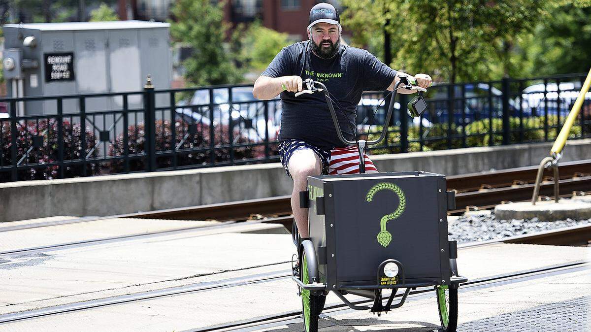 Brad Shell, owner and head brewer at The Unknown Brewing Company, crosse the light rail line on Remount Road.
 More than 30 cyclists lost their pants but found some fun as they rode along the light rail line from  Remount Road  to the 1300 block of Mint Street. 
The no pants bike ride was promoting bicycle safety and awareness, Sustain Charlotte, 24 Hours of Booty and fun.
 "Charlotte has a chance to be a great, great city," says Brad Shell owner and head brewer of The Unknown Brewing Company. "The thing is, Charlotte needs some cultural nudging. Let's do something strange."  
 Shell says he could be home washing his car or doing his taxes but instead he's having some fun. "Loosen your tie and drop your pants," he says. "Just do something that's fun in life."
 The Unknown Brewing Co., 24 Hours of Booty, Queen City Bicycles and Good Bottle Co. all teamed up on Saturday, May 21, 2016 for the bike ride.