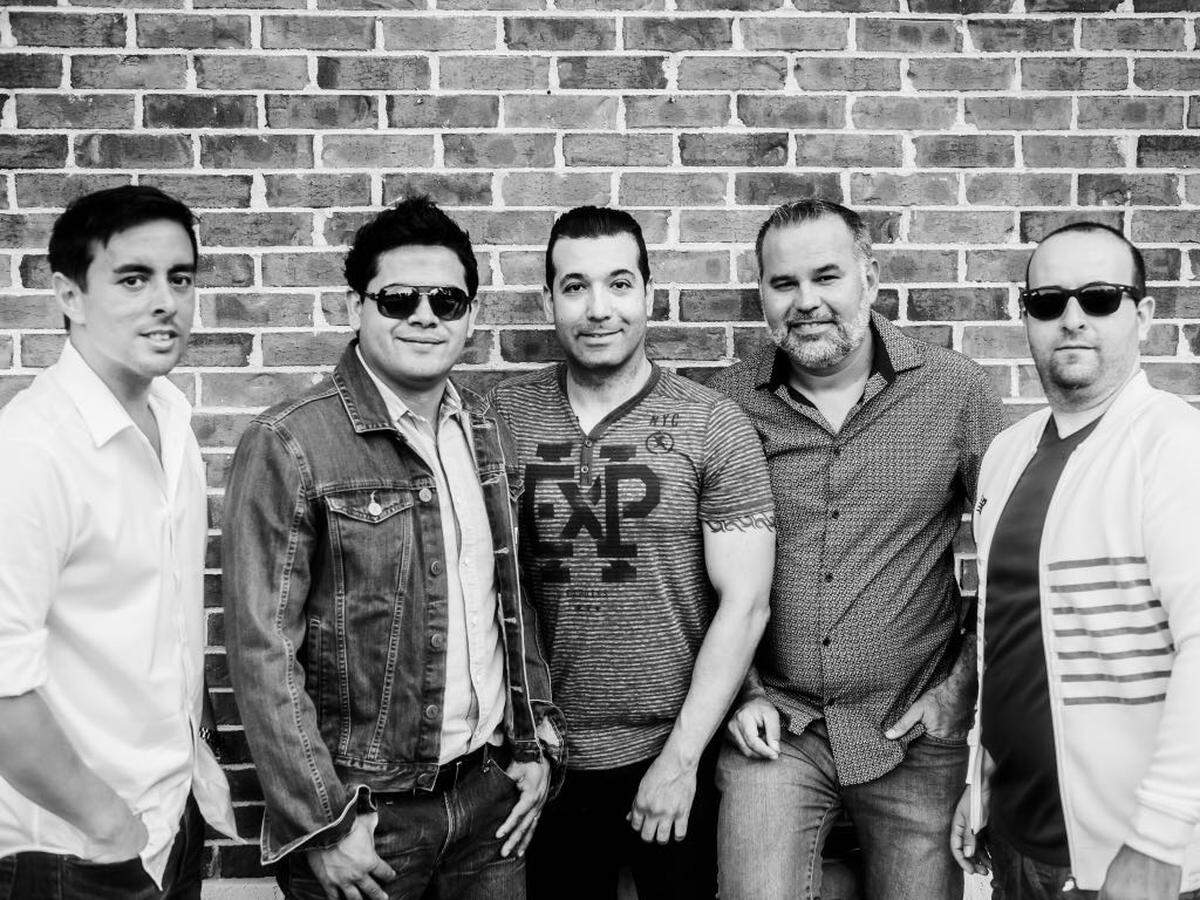 Photo by Jorge Torres<br/>Fred Figueroa, center, with his band UltimaNota