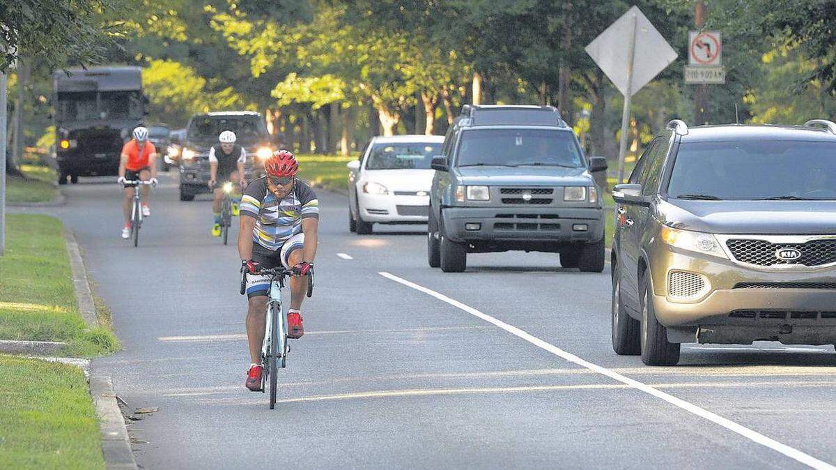 Cyclists ride The Booty Loop course along Queens Road on Wednesday.
Photo by David T. Foster III /Charlotte Observer