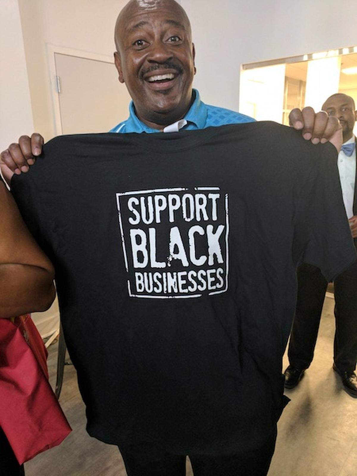 At the CMBCC mid-year mixer, members and guests learned about the organization, networked and entered a raffle for prizes like this "Support Black Businesses" t-shirt.