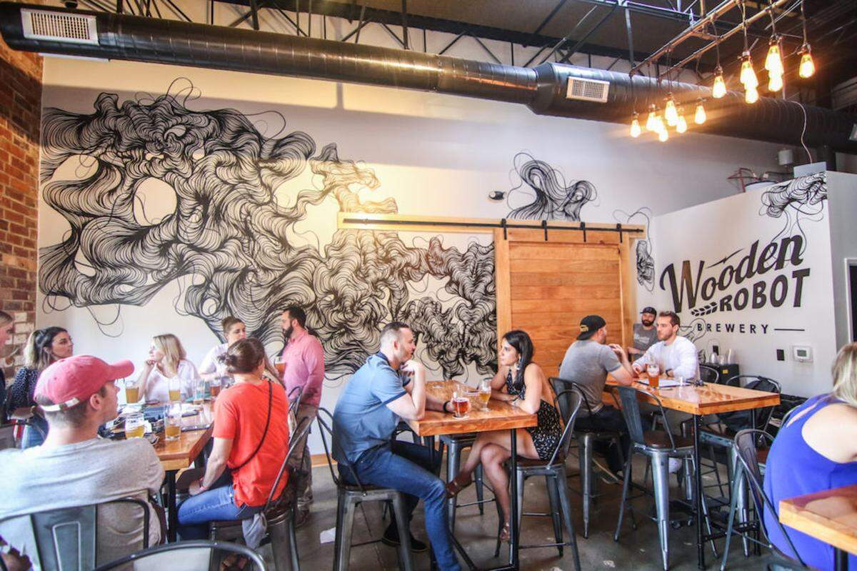 Owl from Southern Tiger Collective created the Wooden Robot Brewery taproom mural.