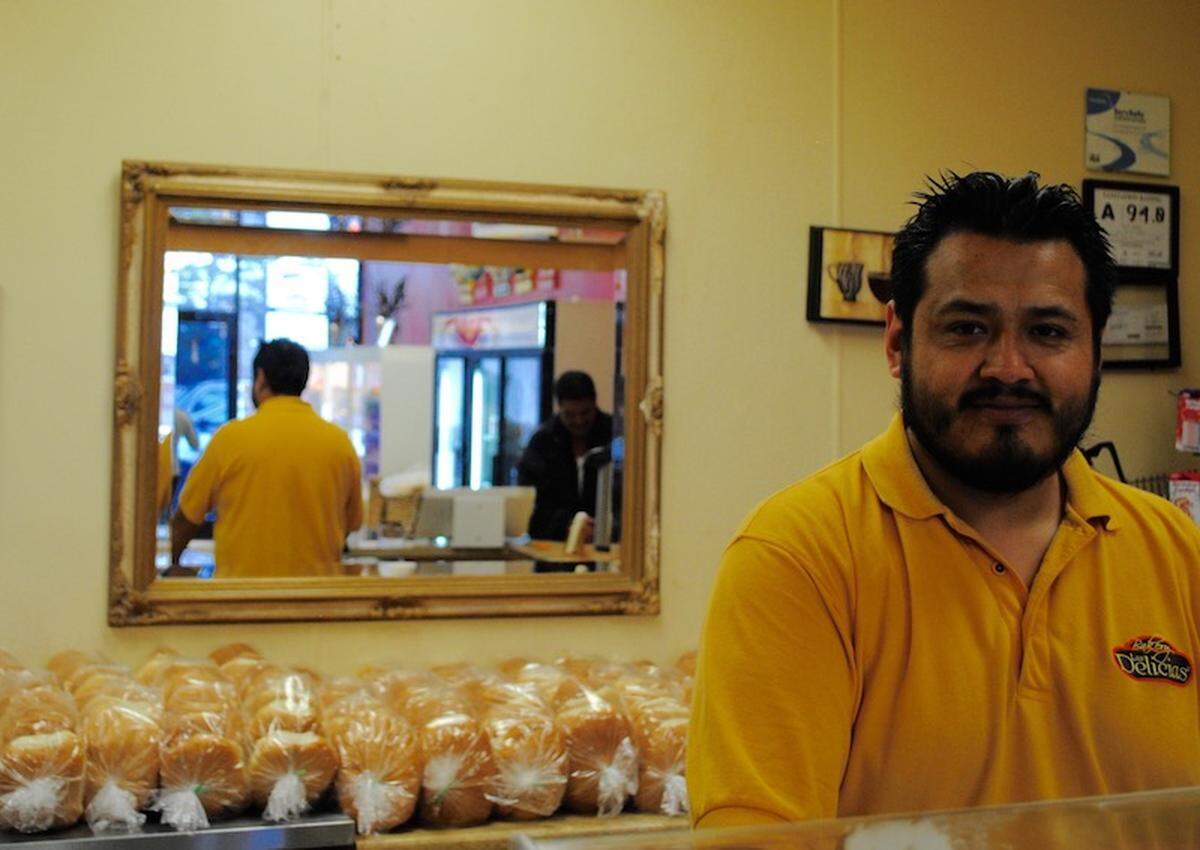 Miguel, 34, manages the register at Las Delicias.