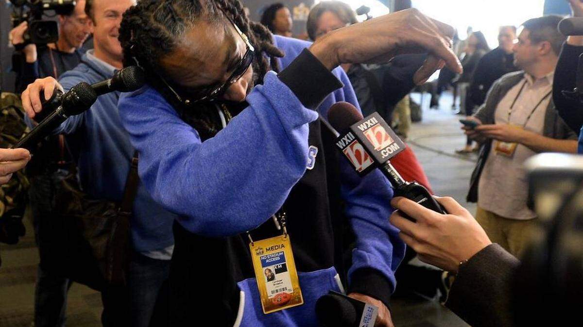 Photo by Jeff Siner / The Charlotte Observer
Entertainer Snoop Dogg dabs after speaking with Carolina Panthers wide receiver Ted Ginn Jr. during a 2016 media availability session.