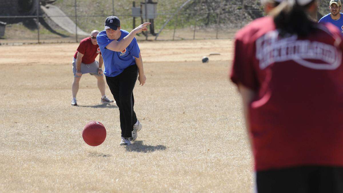 Josh Dykema (left) of team “Wine Vault Winos” pitches to a team “Old School” kicker during their game at Bryant Park on Sunday afternoon as part of Charlotte’s Glory Division, a member of WAKA, the World Adult Kickball Association. Charlotte native Emah Buchanan-Wright founded the league two years ago. Having played for a year in Greenville, SC she founded the league when she moved back to Charlotte and started her career. There are about 250 players in Charlotte. She says she simply went from establishment to establishment carrying a kickball asking people if they were interested in playing. It is as much a social gathering as a competition. DAVID T. FOSTER III-dtfoster@charlotteobserver.com