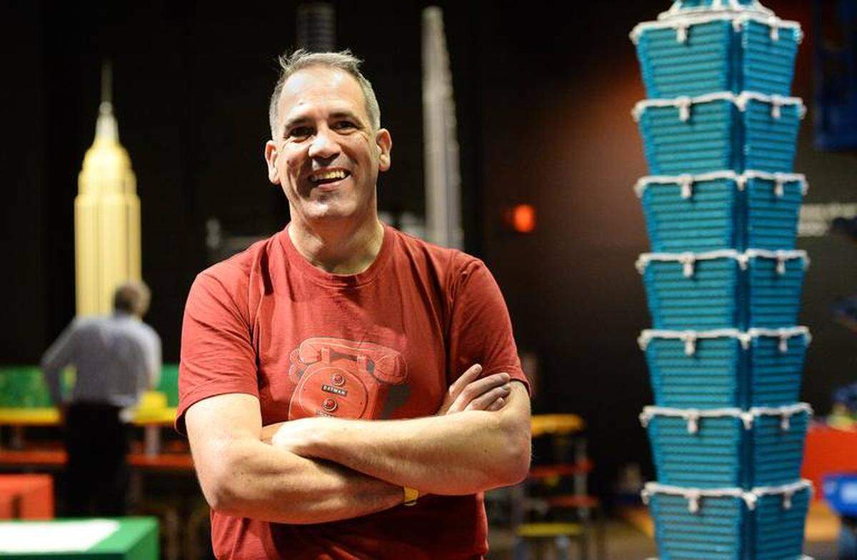 John Simmons / The Charlotte Observer<br/>Ryan McNaught, one of only 14 certified Lego professionals in the world, has led the team that brought 20 Lego skyscrapers from Australia to Discovery Place in Charlotte.