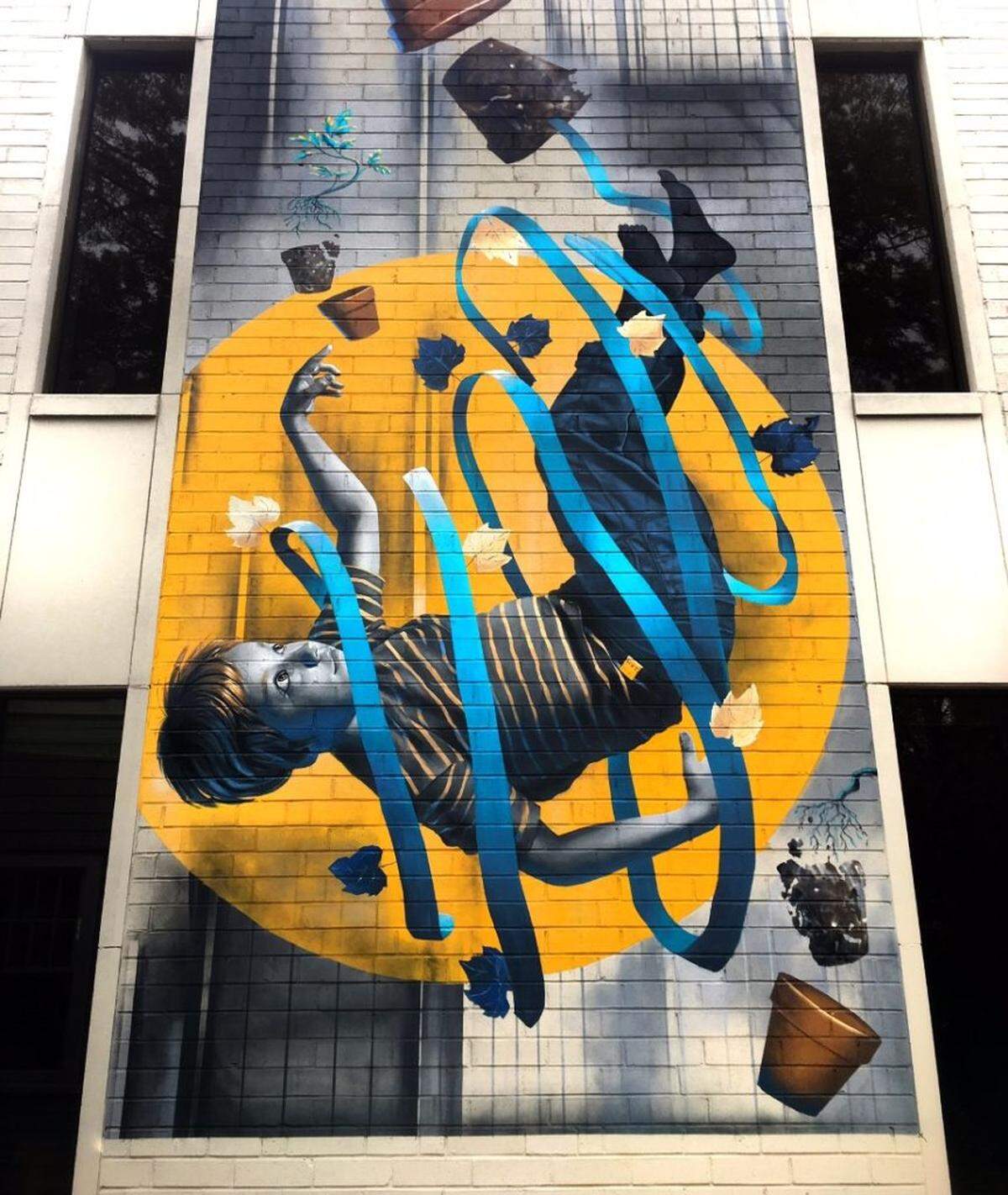 This is a mural Napoletano just completed, found on the facade of the Lineberger Dentistry building.