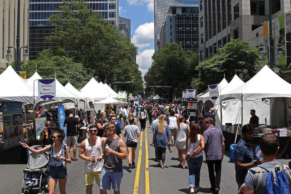 Thousands walked down S. Tryon St. on Friday for the 19th annual Taste of Charlotte event where patrons can sample from dozens of local restaurants as well as do some shopping from local vendors. Pictures were made on S. Tryon Street on June 9, 2017.