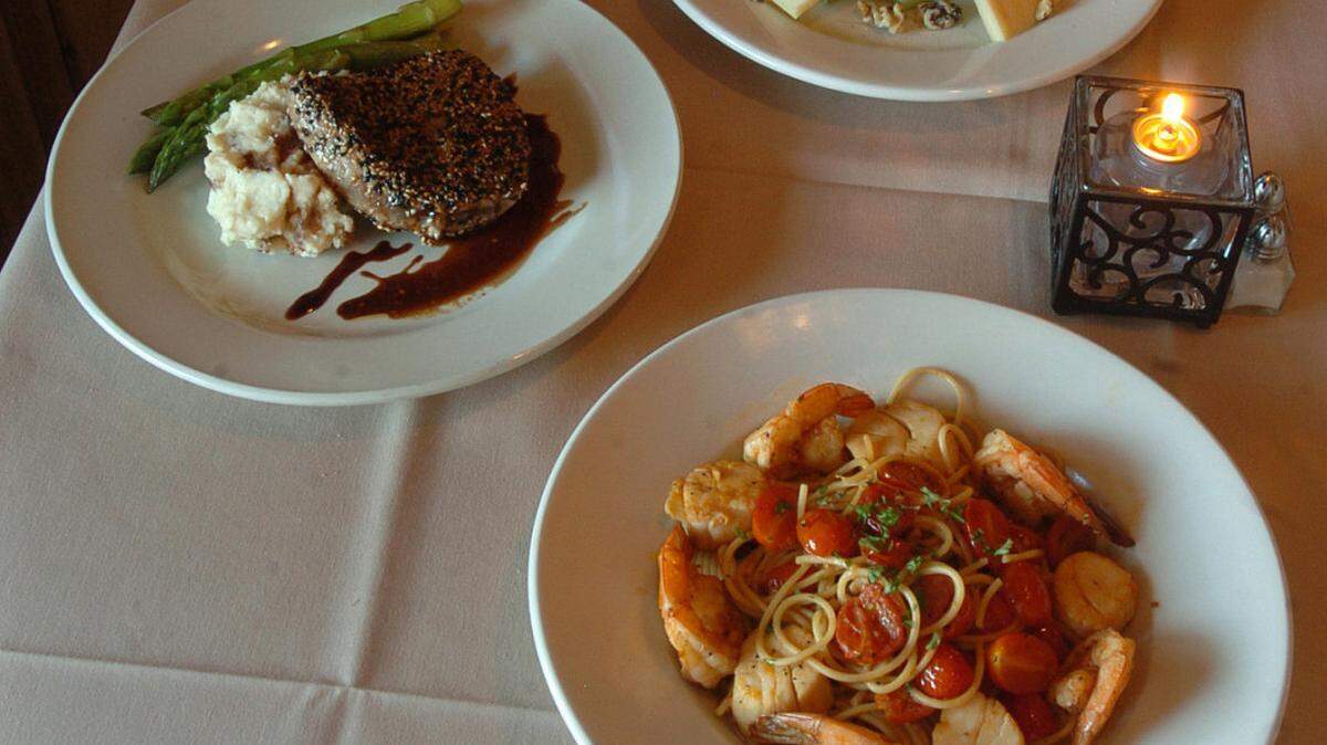 For Dining Out column in Southern Mecklenburg, some of the dishes offered at Arooji's Wine Room at Promenade on Providence shopping center. In front is Pasta d'Amelia (seafood pasta), at middle is Tuna Balsamic (Pinot-Bianco) and at back is Barola (cheeses).  Diedra Laird-dlaird@charlotteobserver.com