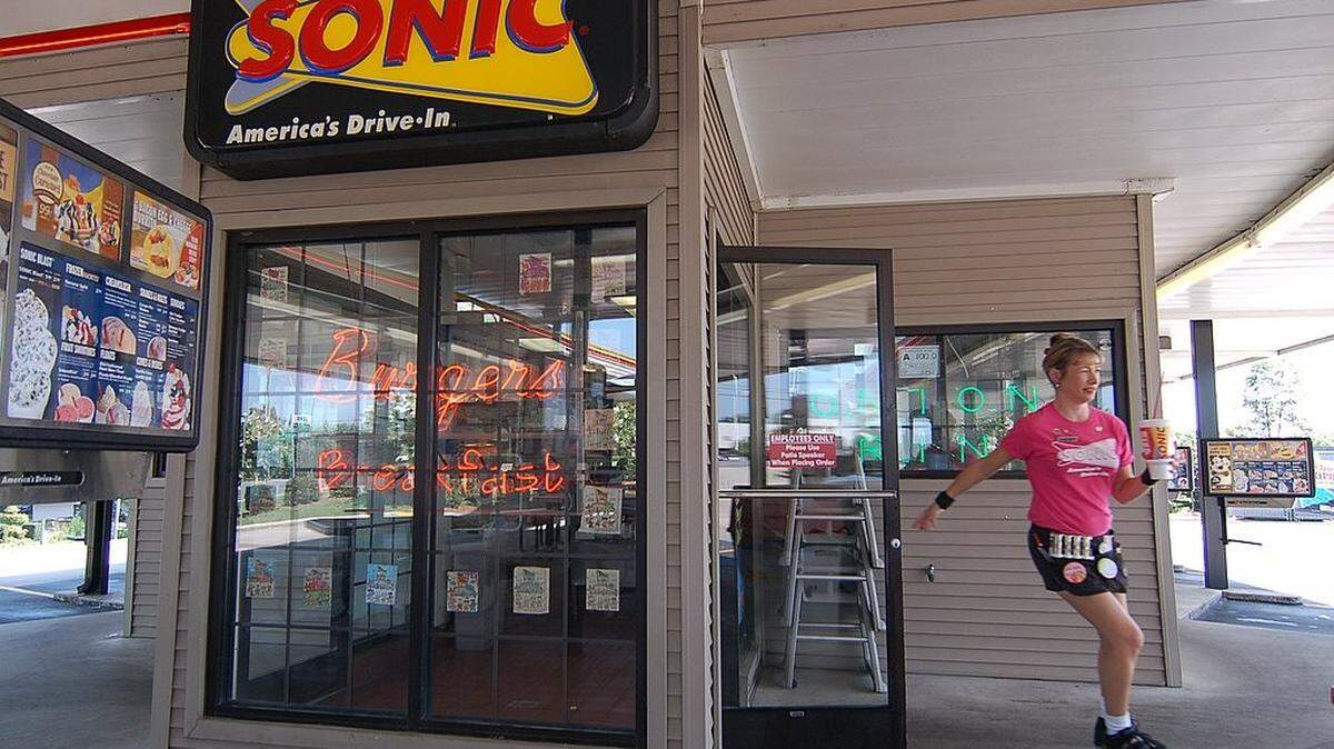 Police in Del City, Oklahoma say charges are expected against two people accused of shattering the front class of Sonic Drive-In after a dispute over chicken tender sauce.