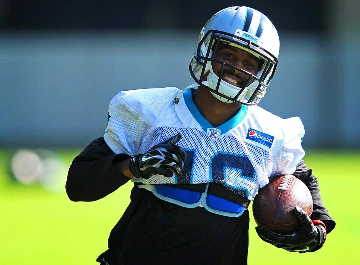 Carolina Panthers wide receiver Corey Brown smiles after catching a pass in an end zone during practice on Wednesday, August 26, 2015.