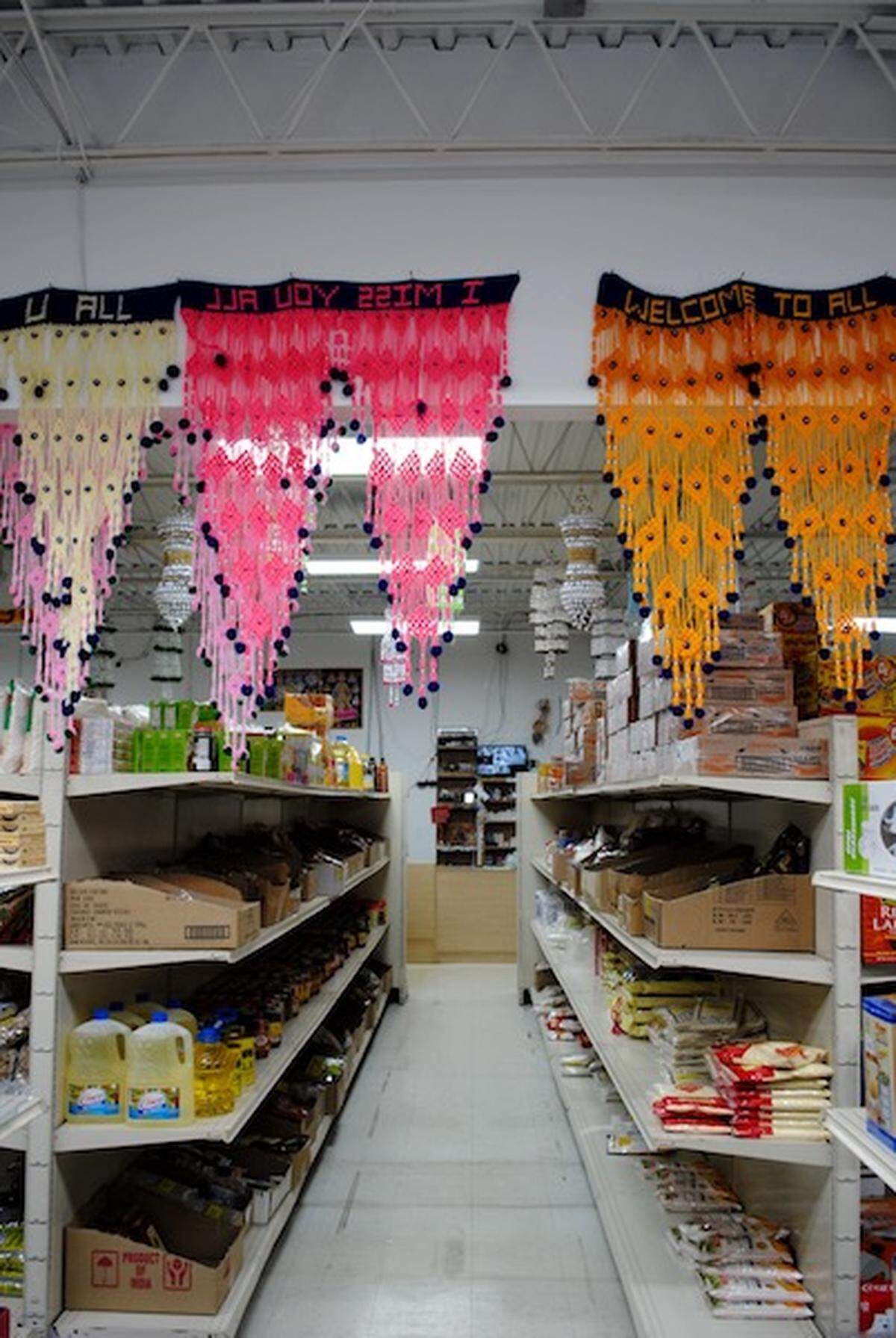 Colorful banners decorate the aisles of Rohan Grocery, located on Driftwood Drive.
