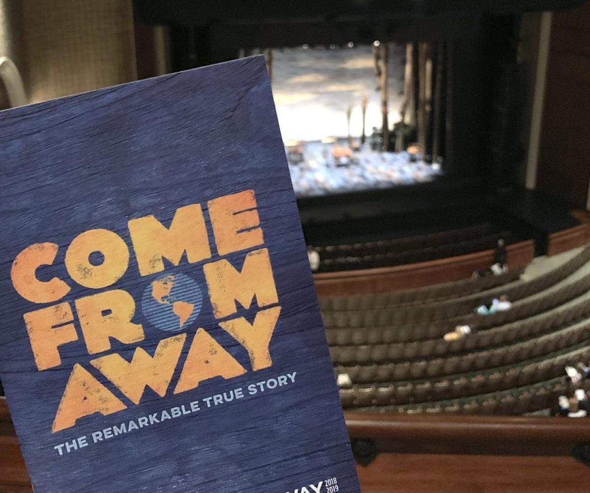 Photo by Melissa Oyler<br/> Playbill from Come From Away