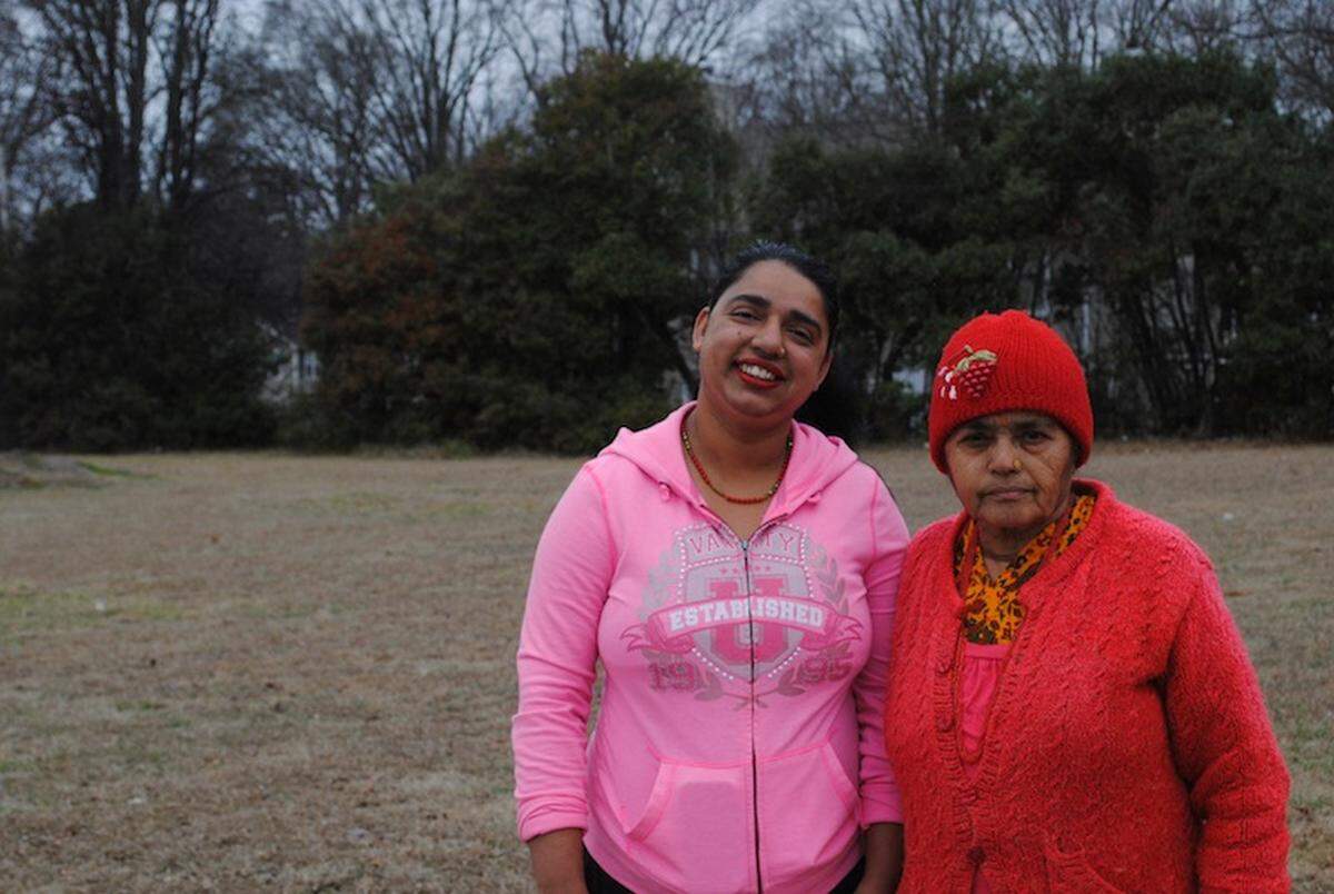 Ganga Chamlagai (left), 32, poses with her mother, Khina Chamlagai, 68, outside Rohan Grocery. They moved to Charlotte from Nepal two years ago.