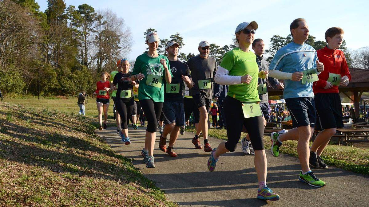 10k runner begin the trip around the lake at Freedom park Saturday morning.
 The National Brain Tumor Society holds its inaugural Charlotte event on Saturday, March 22, 2014 at Freedom Park. Brain tumor survivors will take part in a 10K, 5K &amp; walking events to raise money to find a cure for the deadly disease. The first race, the 10k, kicked off at 8:30am, the 5k began at 9:30 and the walk started at 9:35 a.m.