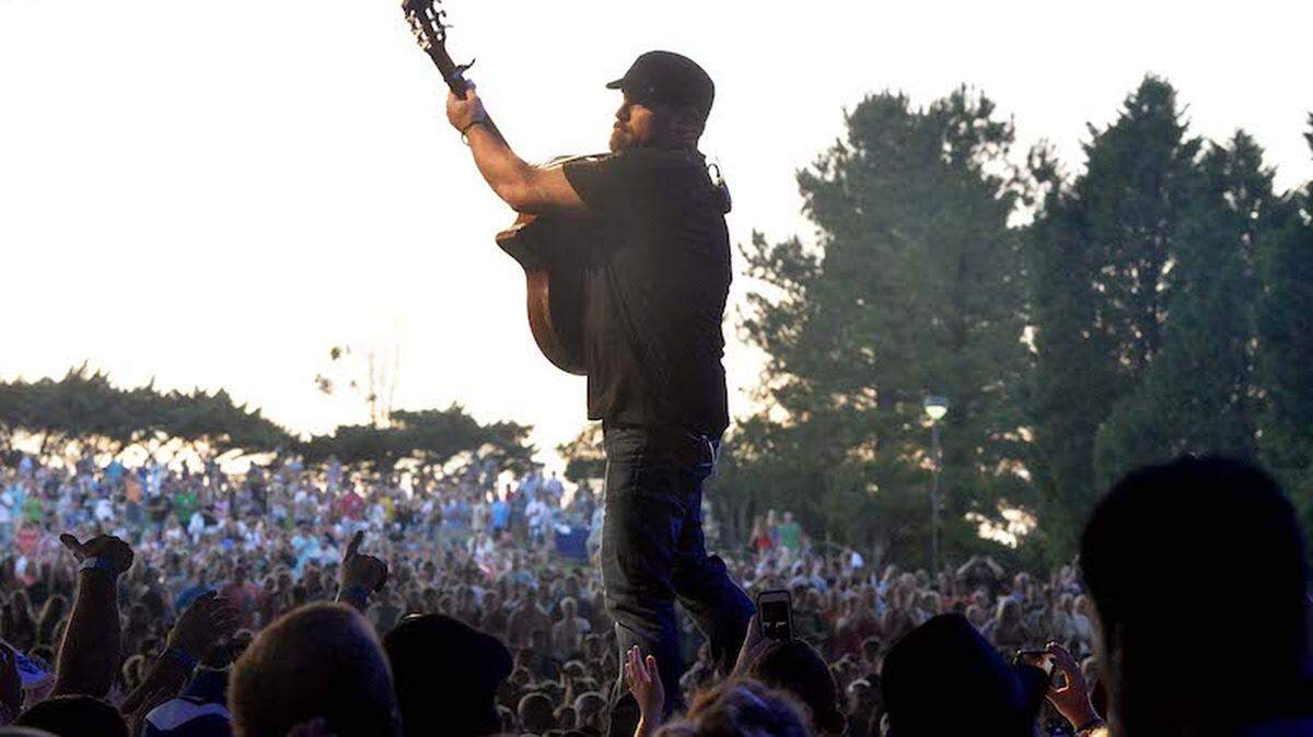 Zac Brown performs on stage at PNC Music Pavilion in 2014. Photo by Robert Lahser.
