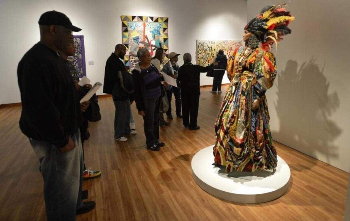 Visitors to the Harvey B. Gantt Center for African-American Arts + Culture check out an exhibit. Photo by Davie Hinshaw