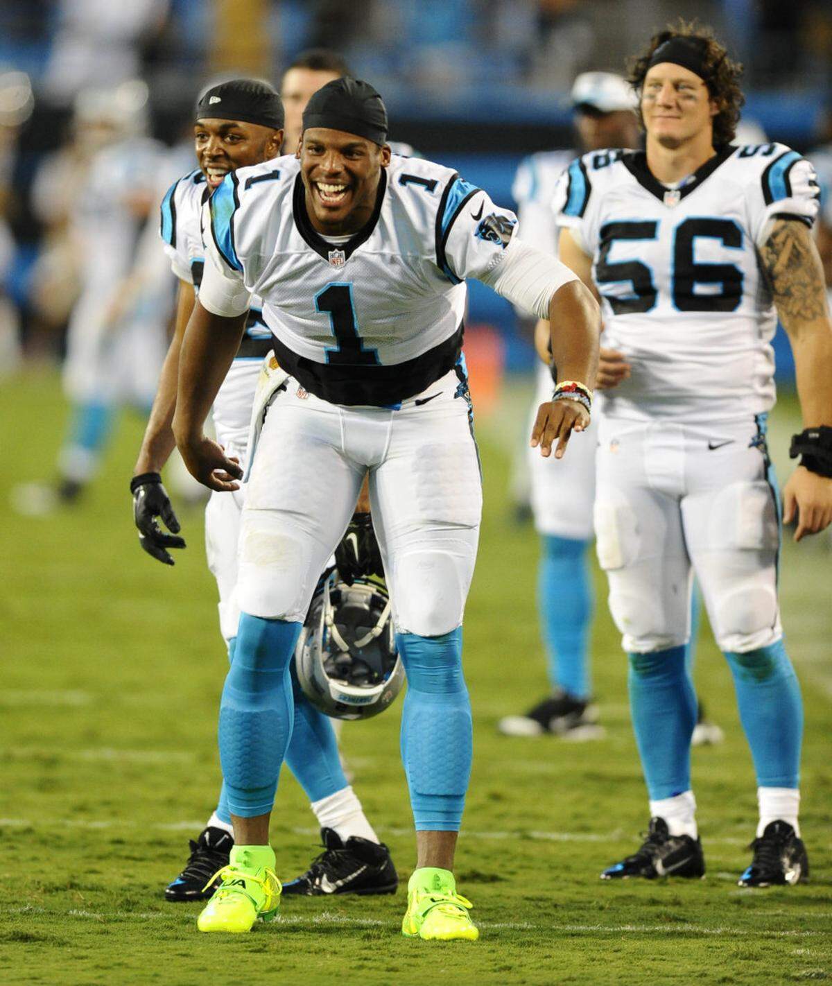 Carolina Panthers' Cam Newton (1) and A.J. Klein (56) react to the teams' scoring against the Miami Dolphins in the second half during their preseason game at Bank of America Stadium on Saturday, August 22, 2015. The Panthers won, 31-30.