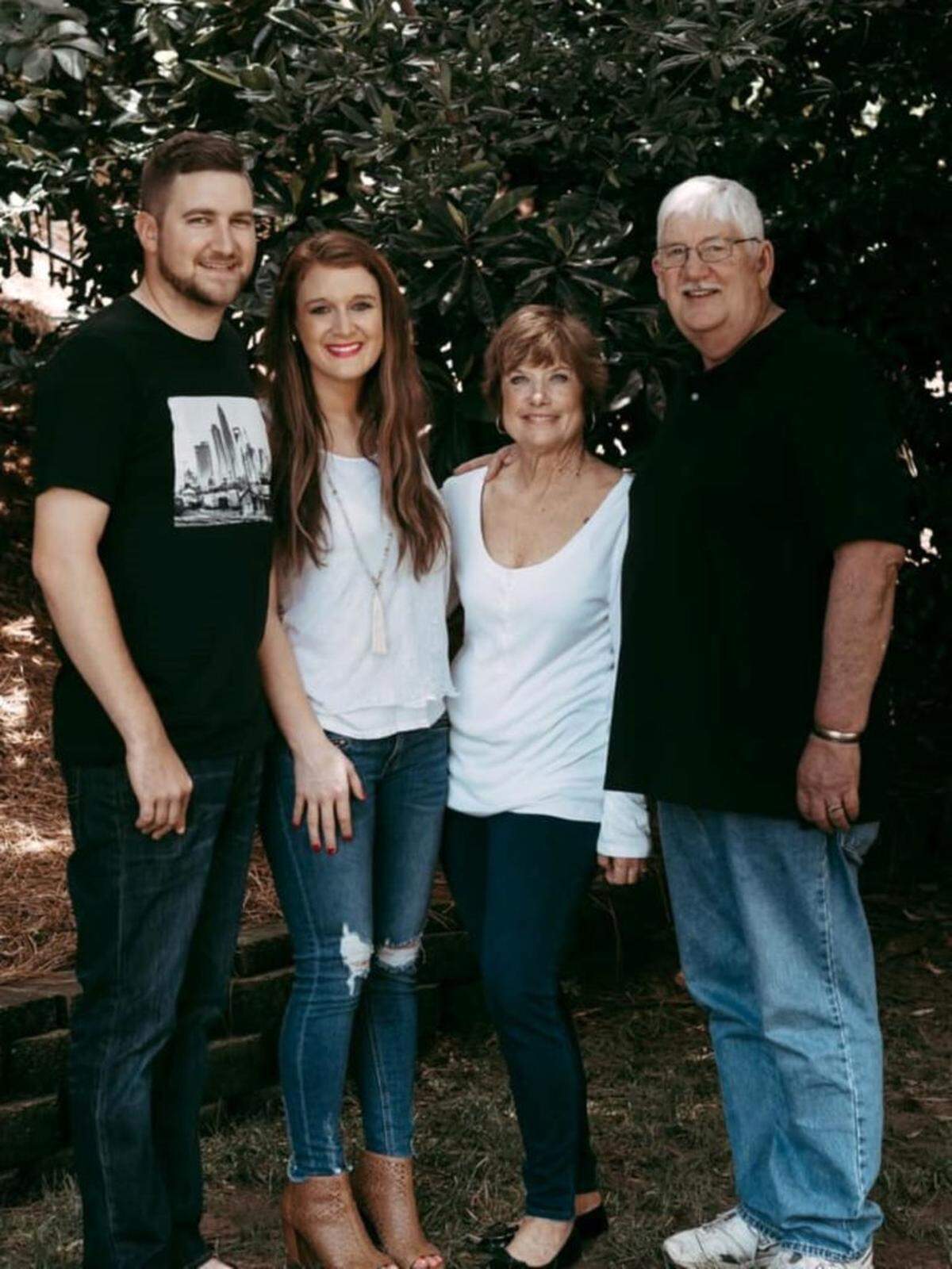 Courtesy of Nicole George<br>Nicole George with husband Jeremy and family